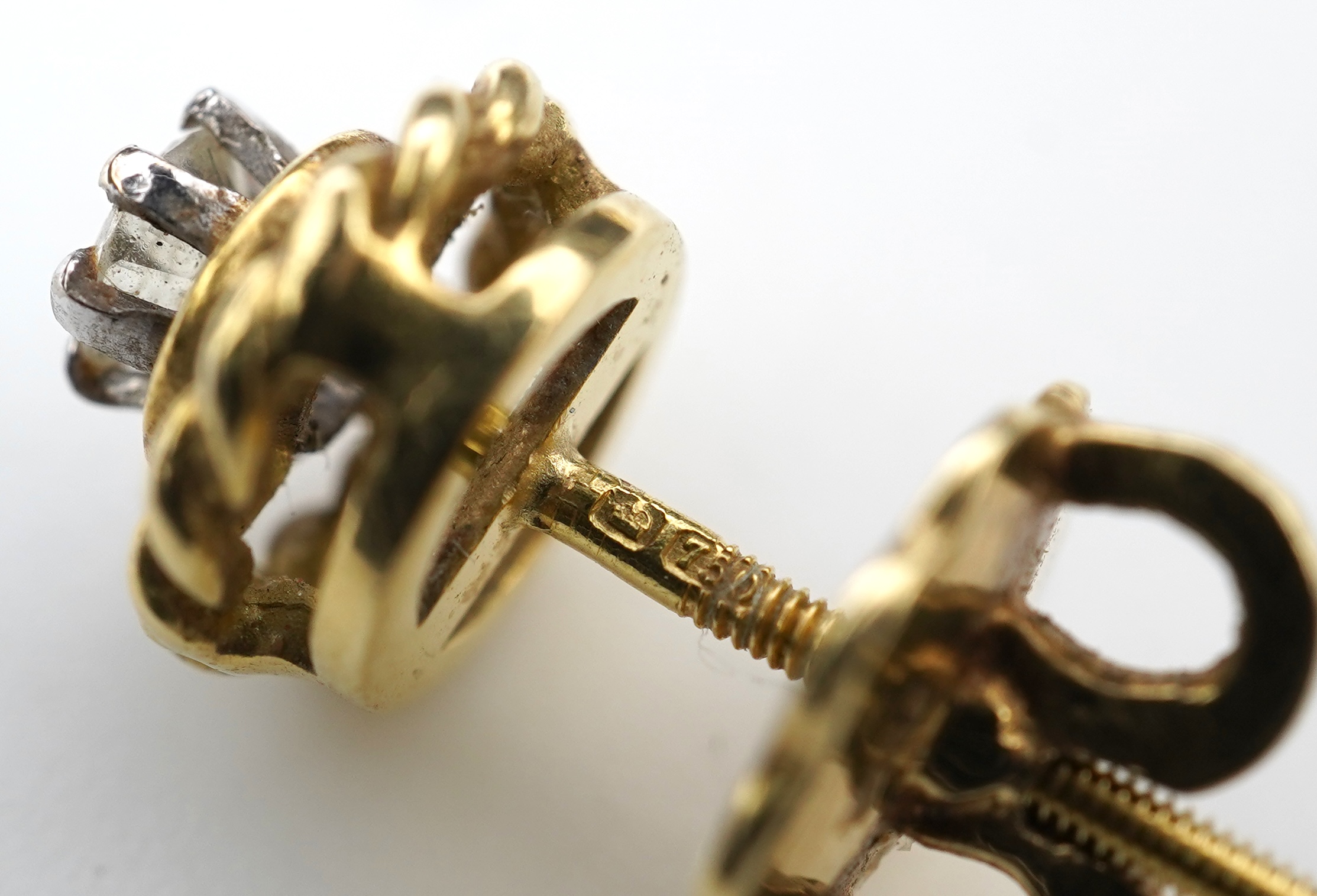 A pair of diamond stud earrings